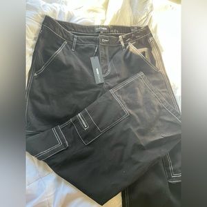 Brand New, tags attached, women’s black cargo pants. Size 13.